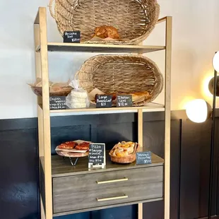 a shelf of bread and pastries
