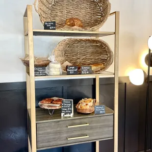 a shelf of bread and pastries