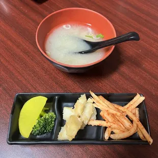 a bowl of soup and fries