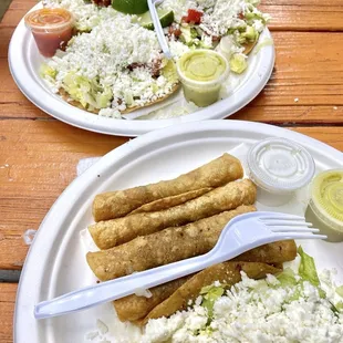 two plates of food on a wooden table