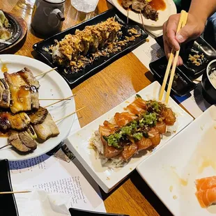 a table full of different types of sushi