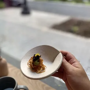 a person holding a plate of food
