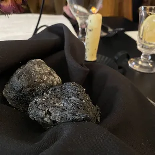 Squid ink biscuits with herb butter candle