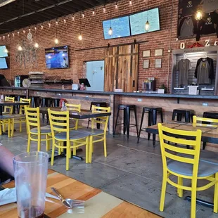 a man sitting at a table with a drink