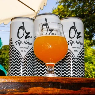 three cans of beer on a table