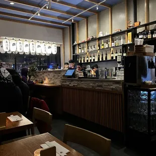 a bar with people sitting at it