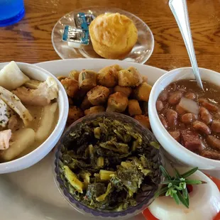 Ozark Sampler with chicken and dumplings, pinto beans, fried okra, greens, and a corn muffin