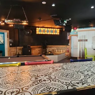 a bar with a pool table