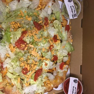 a pizza with lettuce and cheese