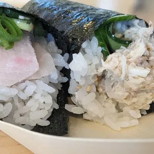 two pieces of sushi on a plate