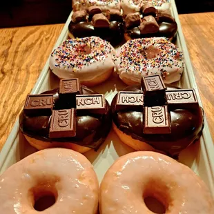 a tray of doughnuts on a table