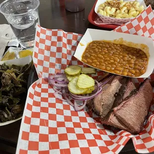 Sliced brisket with beans and collard greens