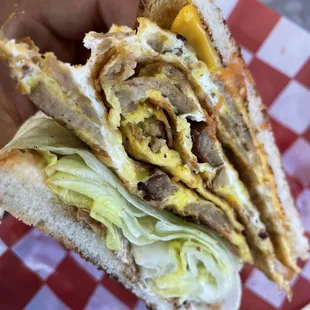 Sausage, Egg and Cheese Sandwich with lettuce...