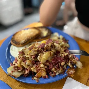 a plate of corned beef hash browns