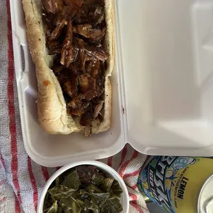 Bbq rib sandwich, greens, can of lemon tea