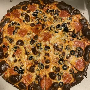 Pepperoni, onions, black olives, and a request to have it well-done.