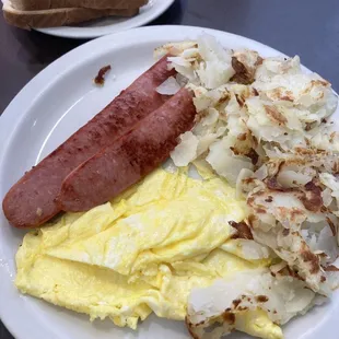 Smoked Sausage with 2 eggs, Home Fries and Toast. (Tuesday Special)