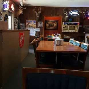 Friendly hometown bar with a strong hunting and fishing theme features a beer garden, pool table, shuffleboard, and big screen tv.