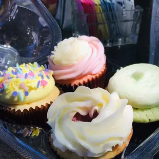 Spring cake, strawberry and creme, margarita, and white chocolate raspberry flavored cupcakes.