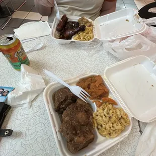 Oxtails with yams and macaroni and cheese; chicken and hot link with macaroni and cheese and mashed potatoes