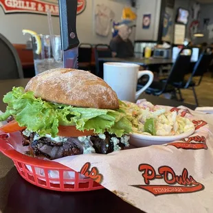 a sandwich with lettuce, tomato, and lettuce