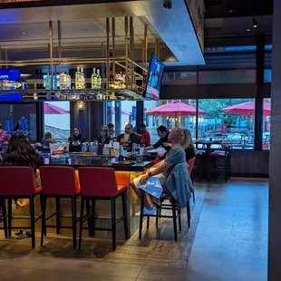  people sitting at a bar