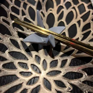  a pair of chopsticks on a plate