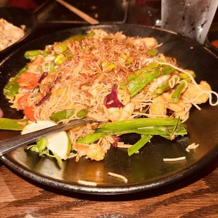  a plate of noodles and vegetables
