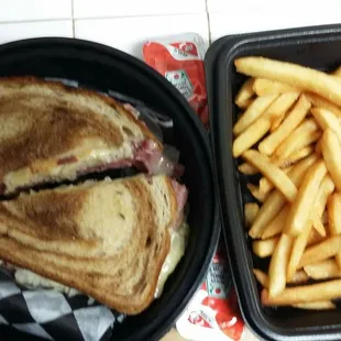 Curbside pickup, Reuben with fries. Well worth the wait for PJs to open for takeout.