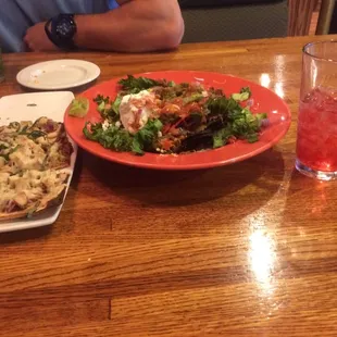 Our nachos, burnt flatbread and "long island"