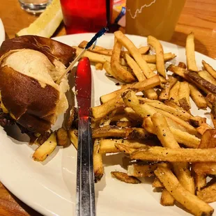 a plate of french fries and a burger