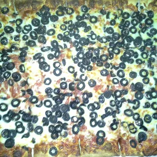 Half sheet black olive pizza.