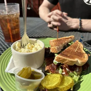 Avocado BLT with potato salad and bread and butter pickles