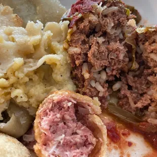 Inside of Reuben ball, cabbage roll and pierogi.