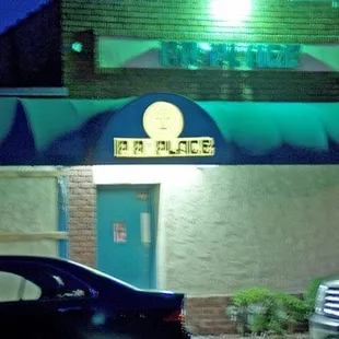 a car parked in front of a restaurant