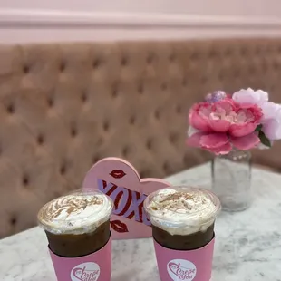  two cups of coffee on a table