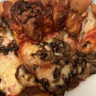 a slice of pizza on a plate