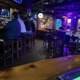 people sitting at the bar