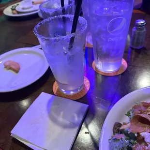 a plate of pizza and a glass of water