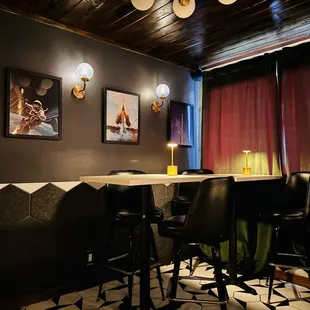 Space-Themed Pictures on Rear Wall