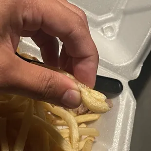a person cutting a piece of food