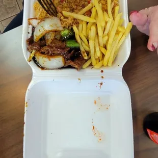 Pepper steak with fried rice and french fries delicious