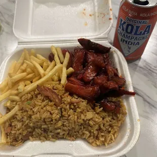 Combination boneless ribs with fried rice and French fries. Delicious! Had with a Kola champagne.