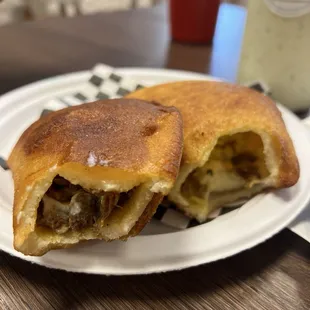 Goat empanada and shredded chicken empanada