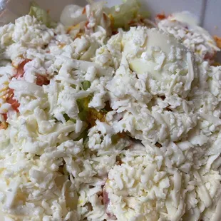 a close up of a salad in a styrofoam container