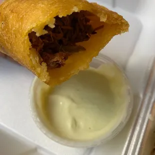 a hand holding a piece of food