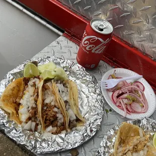  can of coke and a plate of food