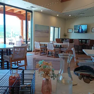 Of you inside the dining room. Sunny patio outside.