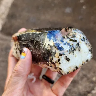 a person holding a piece of rock