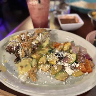 Grilled avocado with brisket and veggies.